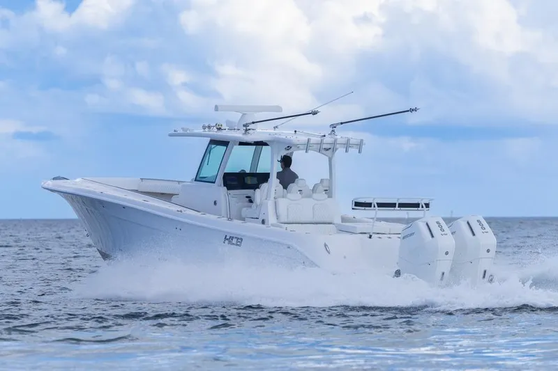  Yacht Photos Pics 2023 HCB 39 Speciale boat cruising on open water under a cloudy sky.