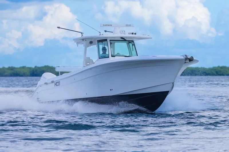  Yacht Photos Pics 2023 HCB 39 Speciale boat cruising on open water under a blue sky.