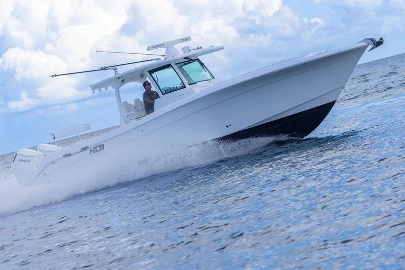  Yacht Photos Pics 2023 HCB 39 Speciale boat cruising on open water under a cloudy sky.