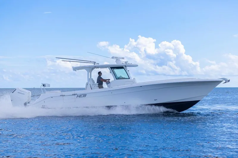  Yacht Photos Pics 2023 HCB 39 Speciale boat cruising on open water under a clear blue sky.