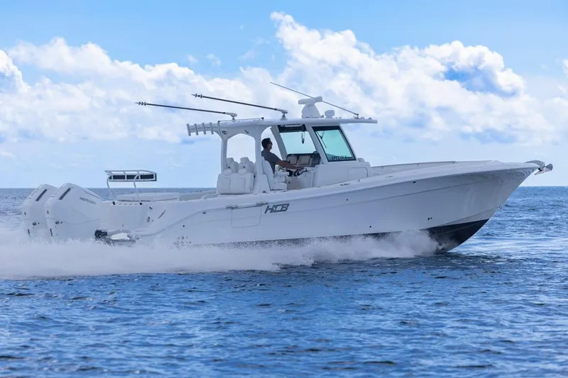  Yacht Photos Pics 2023 HCB 39 Speciale boat cruising on open water under a clear blue sky.