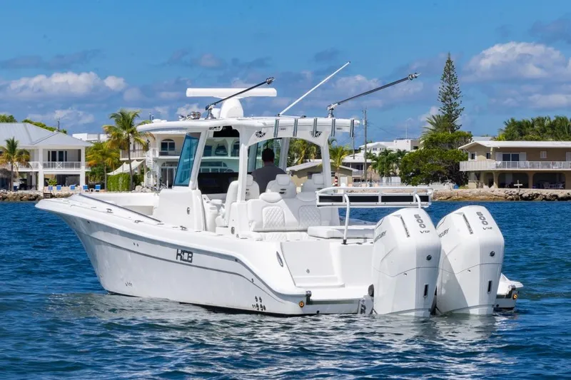  Yacht Photos Pics 2023 HCB 39 Speciale boat on water, featuring dual outboard engines.