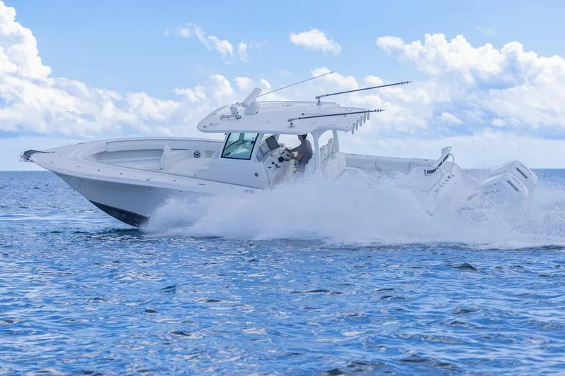  Yacht Photos Pics 2023 HCB 39 Speciale boat cruising on open water with splashing waves.