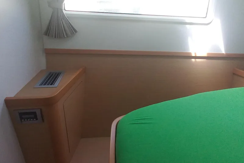Benetnash II Yacht Photos Pics Interior cabin of 2016 Lagoon 42 catamaran with green bedding and window.