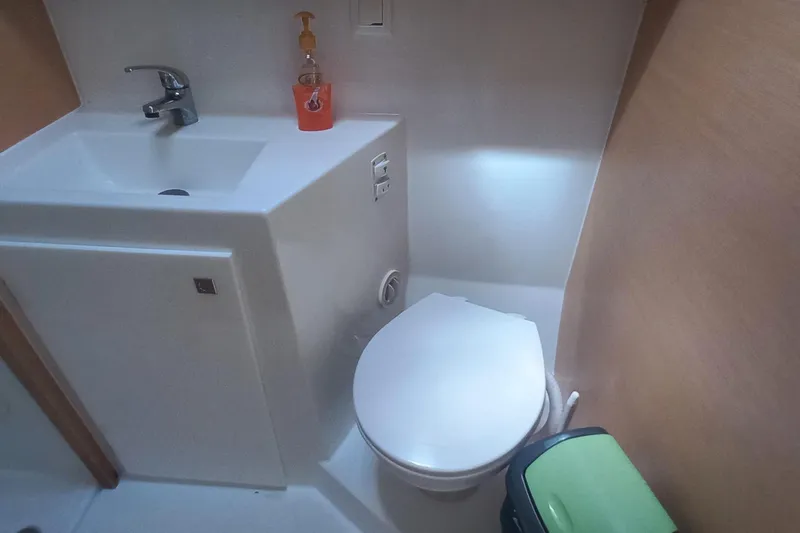 Benetnash II Yacht Photos Pics Bathroom interior of 2016 Lagoon 42 catamaran with sink and toilet.
