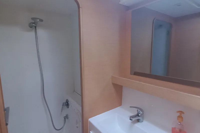 Benetnash II Yacht Photos Pics Bathroom interior of 2016 Lagoon 42 yacht with shower and sink.