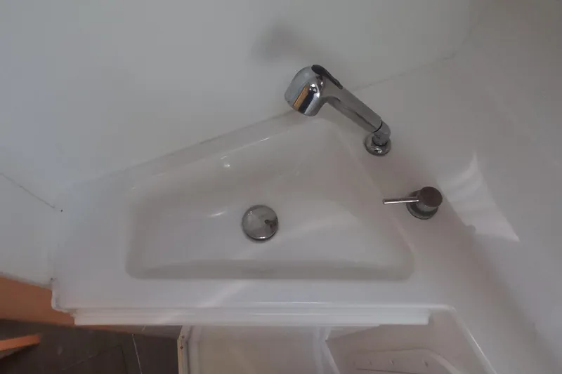 Benetnash II Yacht Photos Pics Compact sink with chrome faucet in 2016 Lagoon 42 yacht bathroom.