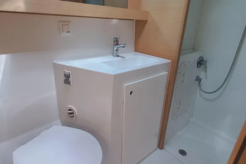 Benetnash II Yacht Photos Pics Modern bathroom in 2016 Lagoon 42 yacht with sink, toilet, and shower.