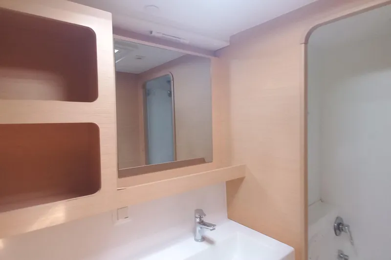 Benetnash II Yacht Photos Pics Modern bathroom interior of 2016 Lagoon 42 yacht with sink and mirror.