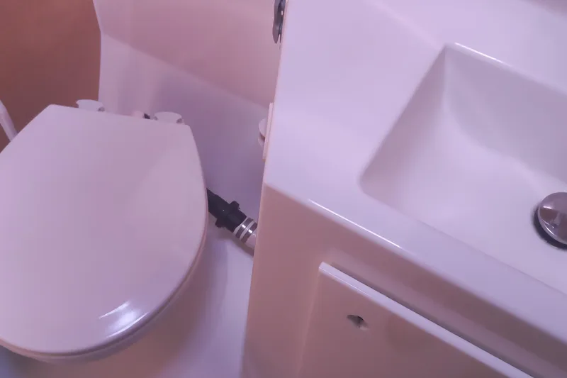 Benetnash II Yacht Photos Pics Bathroom interior of 2016 Lagoon 42 yacht, featuring toilet and sink.