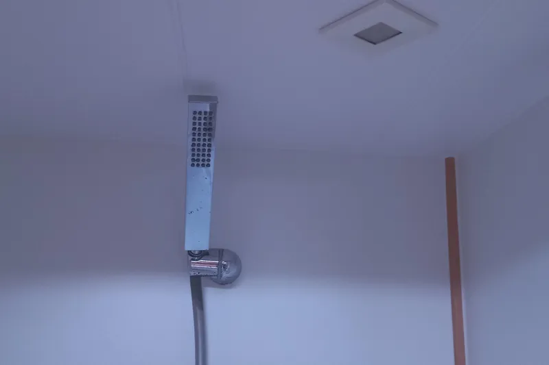 Benetnash II Yacht Photos Pics Showerhead in a 2016 Lagoon 42 yacht bathroom interior.