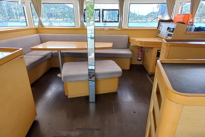 Benetnash II Yacht Photos Pics Interior of 2016 Lagoon 42 catamaran with cozy seating and wooden finishes.