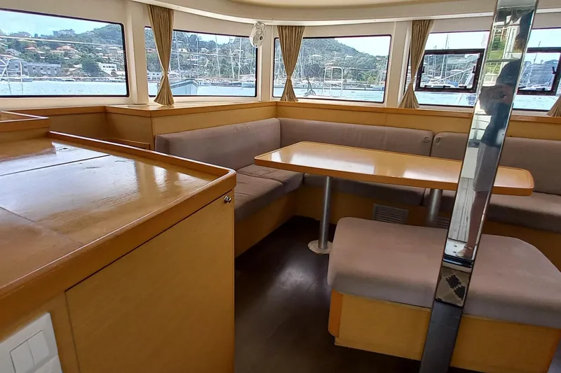 Benetnash II Yacht Photos Pics Interior of 2016 Lagoon 42 catamaran with spacious seating and panoramic windows.