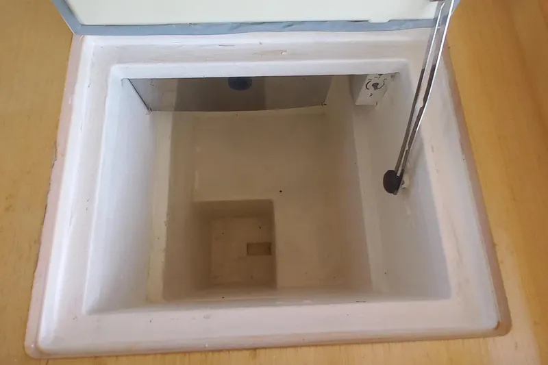 Benetnash II Yacht Photos Pics Storage compartment on a 2016 Lagoon 42 catamaran, featuring a white interior and hydraulic support.