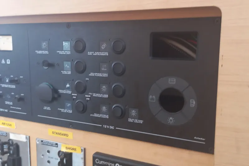 Benetnash II Yacht Photos Pics Control panel of a 2016 Lagoon 42 catamaran, featuring various switches and dials.