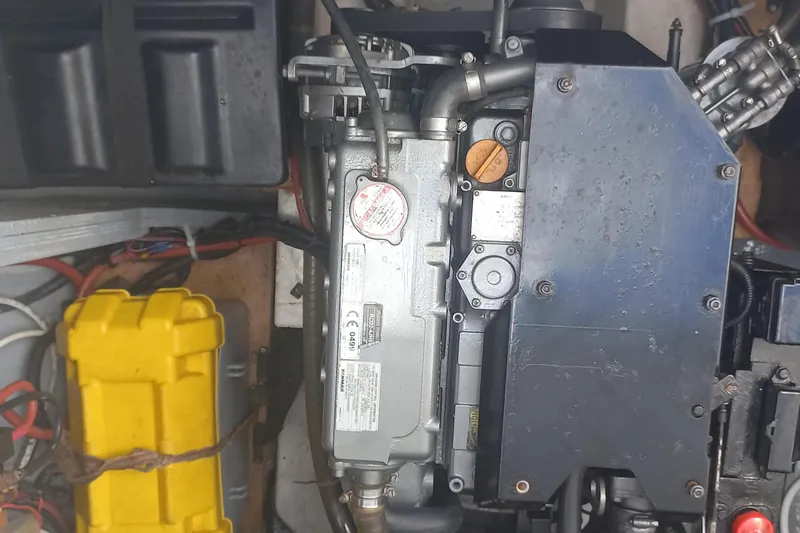 Benetnash II Yacht Photos Pics Engine compartment of a 2016 Lagoon 42 catamaran, featuring mechanical components and wiring.