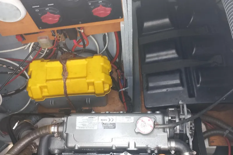 Benetnash II Yacht Photos Pics Engine compartment of a 2016 Lagoon 42 catamaran with wiring and battery.