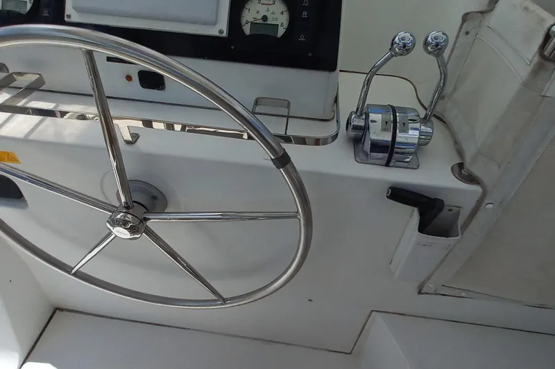 Benetnash II Yacht Photos Pics Steering wheel and controls of 2016 Lagoon 42 catamaran yacht.