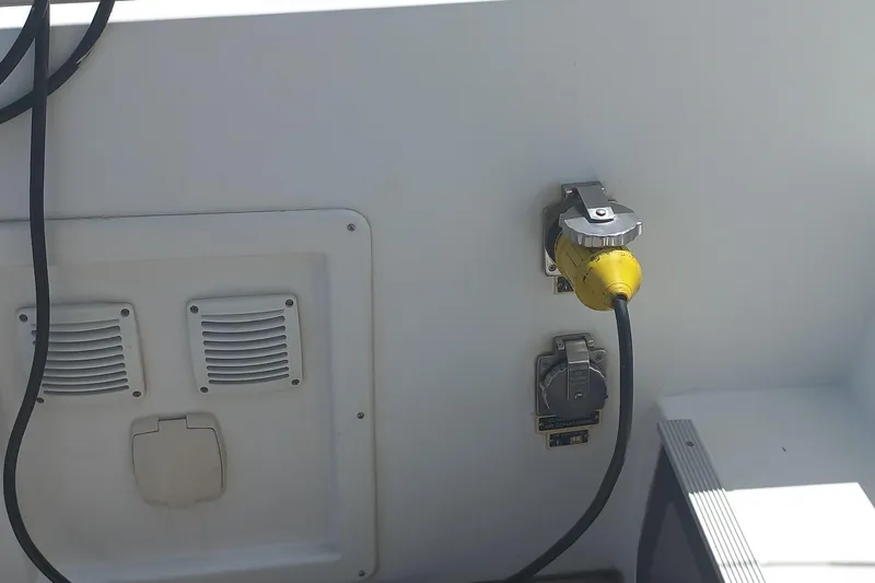 Benetnash II Yacht Photos Pics Electrical connection on a 2016 Lagoon 42 catamaran, featuring a yellow power cable.