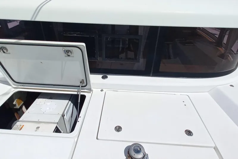 Benetnash II Yacht Photos Pics Open hatch on 2016 Lagoon 42 catamaran deck, revealing interior compartment.