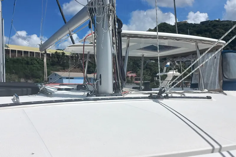 Benetnash II Yacht Photos Pics 2016 Lagoon 42 catamaran deck with rigging, set against a scenic coastal backdrop.