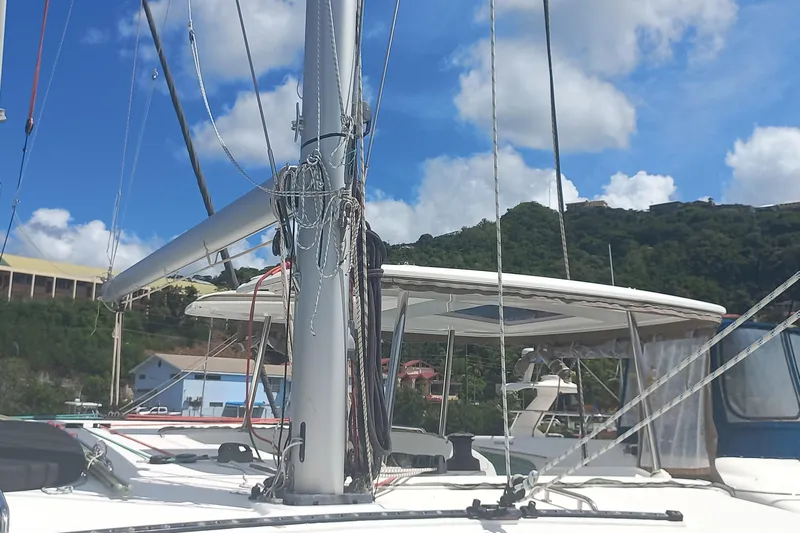 Benetnash II Yacht Photos Pics 2016 Lagoon 42 catamaran with mast and rigging, set against a scenic backdrop.