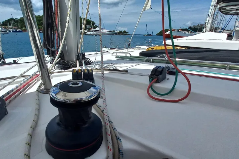 Benetnash II Yacht Photos Pics 2016 Lagoon 42 sailboat deck with ropes and winch, anchored in a marina.