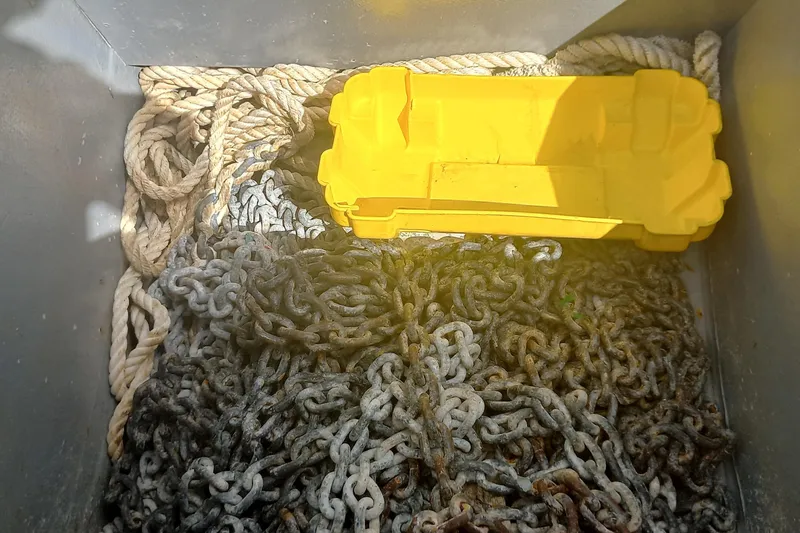 Benetnash II Yacht Photos Pics Rope and chain storage in Lagoon 42, 2016 model, with a yellow container.
