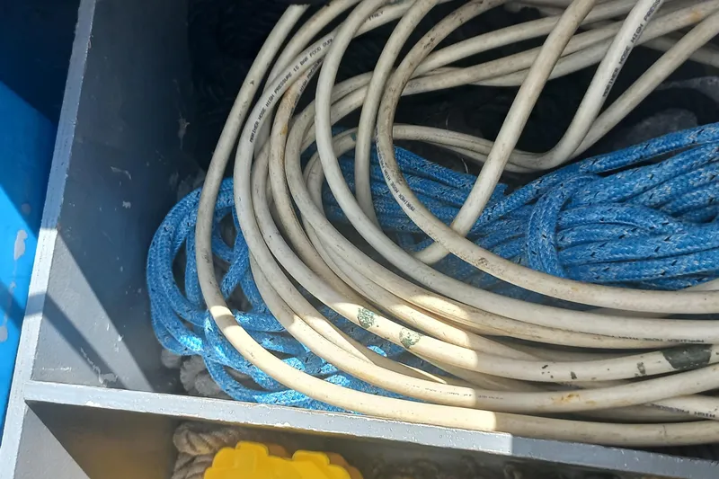 Benetnash II Yacht Photos Pics Coiled ropes in storage on a 2016 Lagoon 42 catamaran.