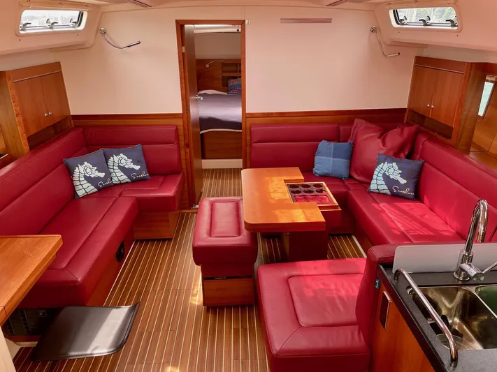 Alegrea III Yacht Photos Pics Interior of a 2016 Hanse 455 yacht with red upholstery.