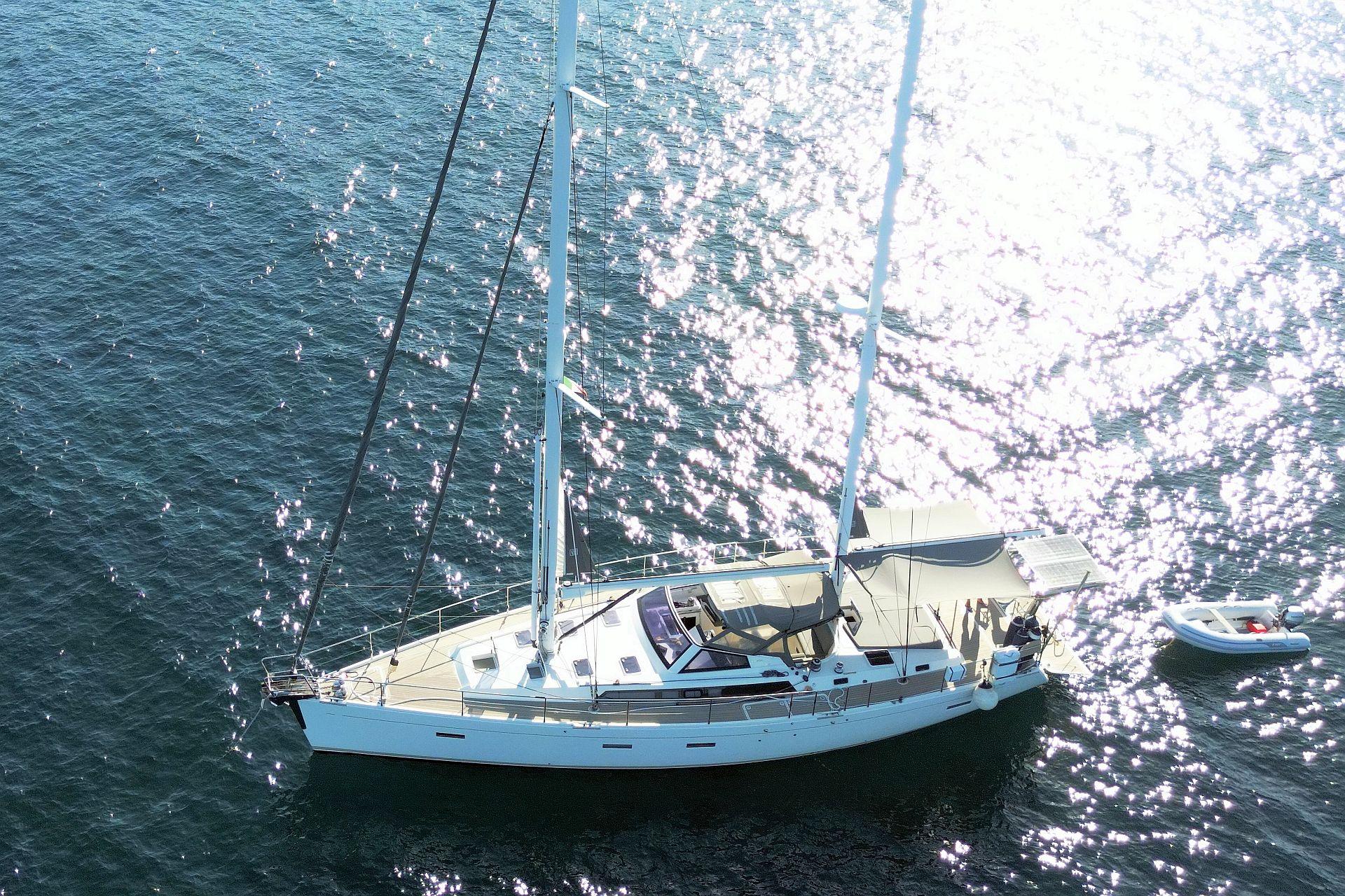 2015 Amel 55 sailing yacht on open sea.