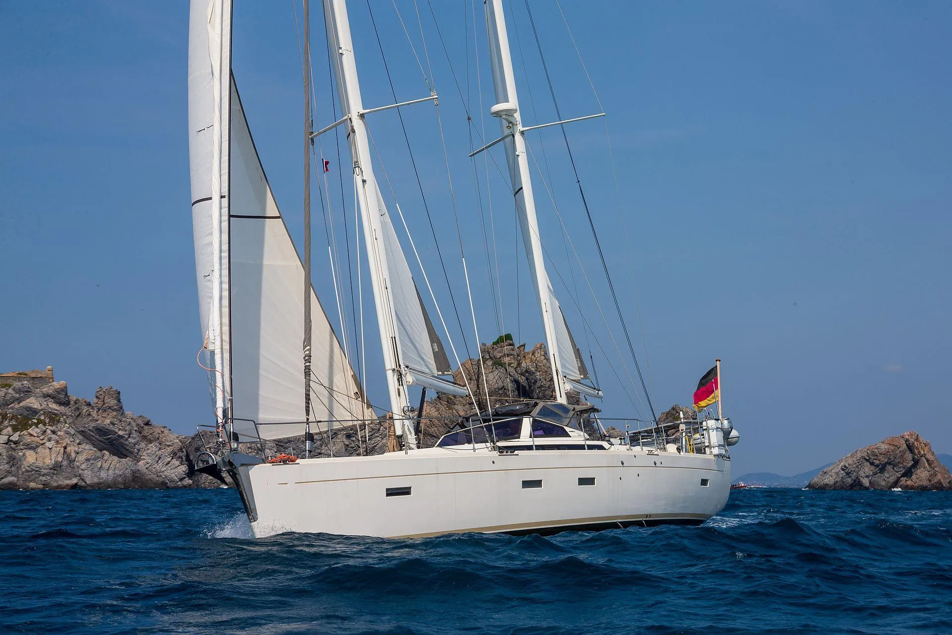2015 Amel 55 sailing yacht on open sea.
