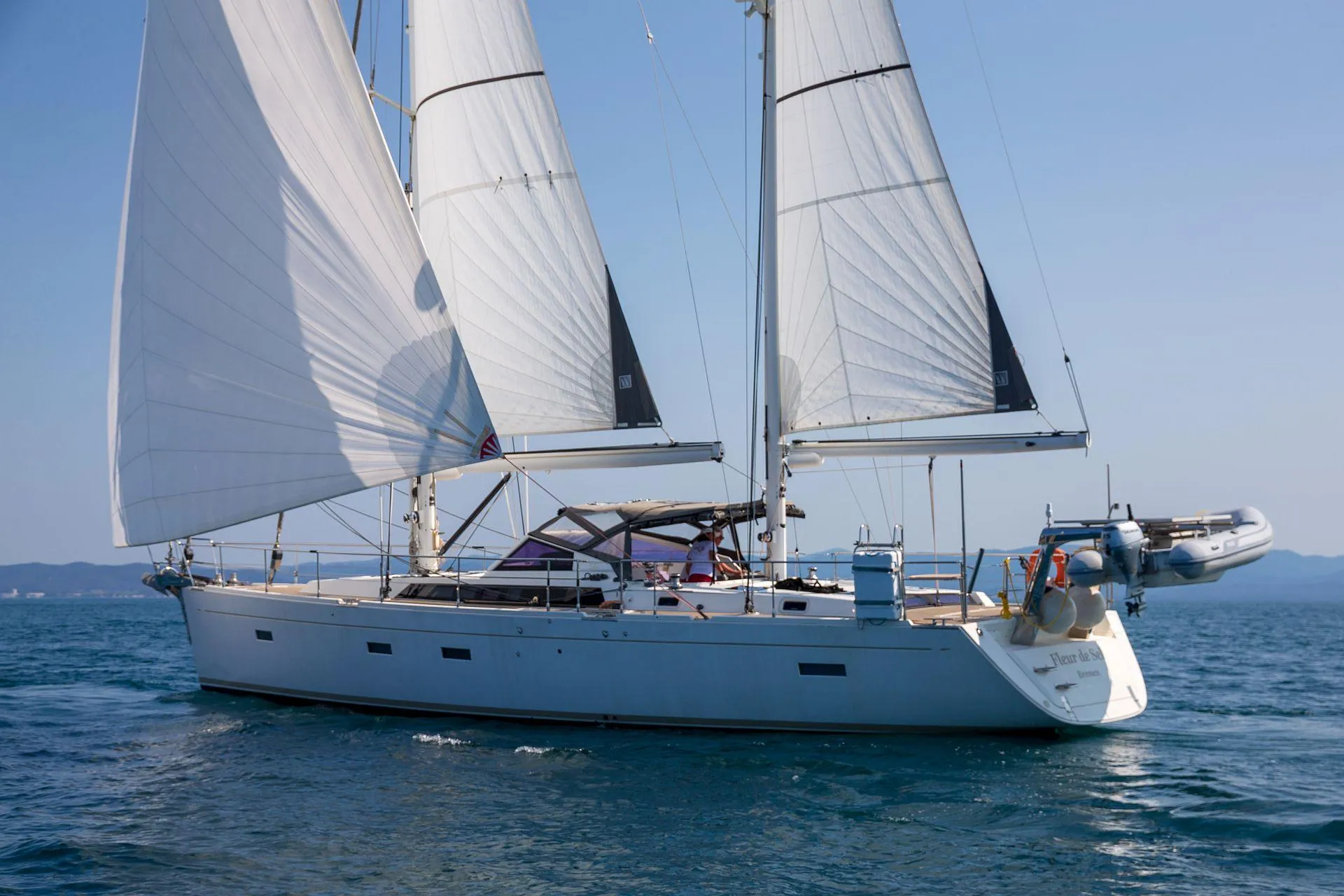 2015 Amel 55 sailing yacht on open sea.