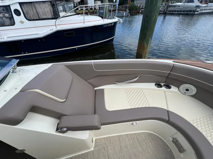  Yacht Photos Pics 2023 Chris-Craft Launch 28 GT boat interior with elegant seating by the water.