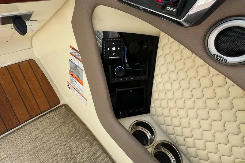  Yacht Photos Pics 2023 Chris-Craft Launch 28 GT interior dashboard with controls and speaker.