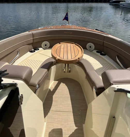  Yacht Photos Pics 2023 Chris-Craft Launch 28 GT boat interior with seating and wooden table.