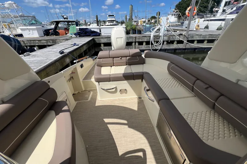  Yacht Photos Pics 2023 Chris-Craft Launch 28 GT interior with luxurious seating at marina.