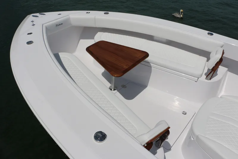  Yacht Photos Pics Luxurious seating area on 2026 Bahama 41 GT boat with wooden table.