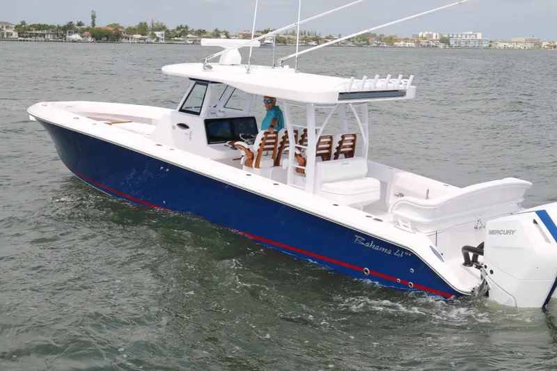  Yacht Photos Pics 2026 Bahama 41 GT boat cruising on water, featuring sleek design and Mercury engines.