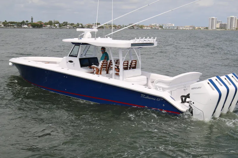  Yacht Photos Pics 2026 Bahama 41 GT boat cruising with multiple Mercury engines on open water.