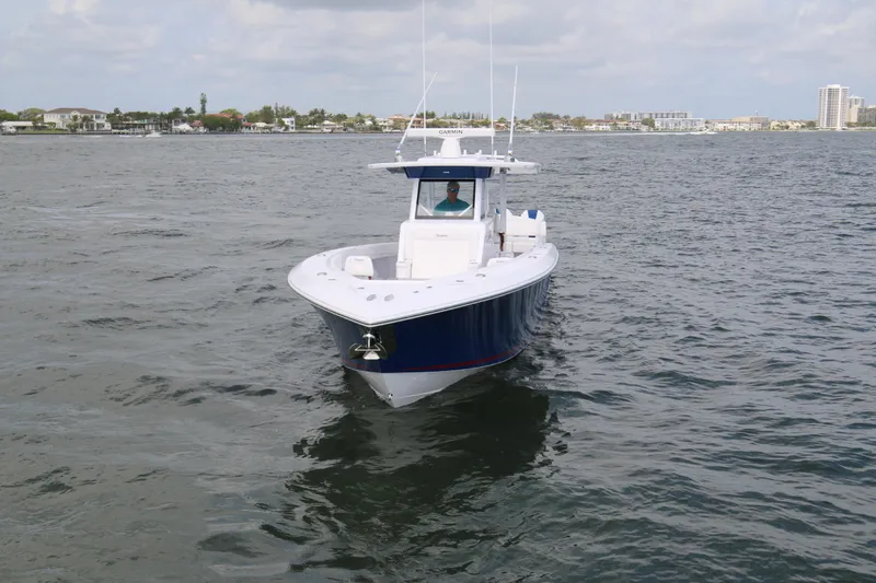  Yacht Photos Pics 2026 Bahama 41 GT boat cruising on open water under cloudy skies.