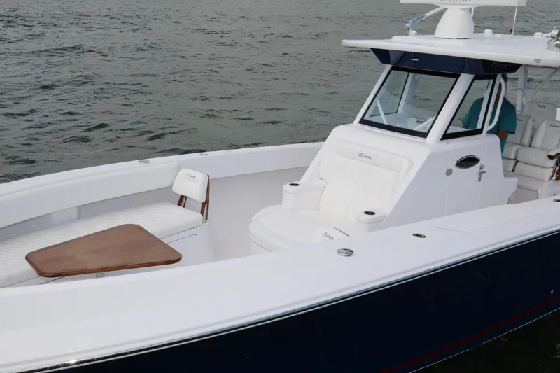  Yacht Photos Pics 2026 Bahama 41 GT boat with sleek design and luxurious seating on water.