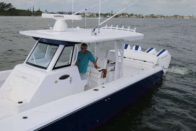  Yacht Photos Pics 2026 Bahama 41 GT boat cruising on water, featuring sleek design and modern technology.