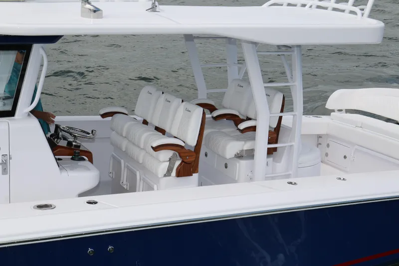  Yacht Photos Pics 2026 Bahama 41 GT boat interior with white cushioned seating and sleek design.