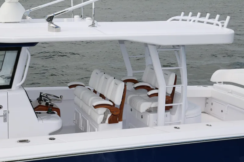  Yacht Photos Pics 2026 Bahama 41 GT boat interior with luxurious seating and helm, on calm water.