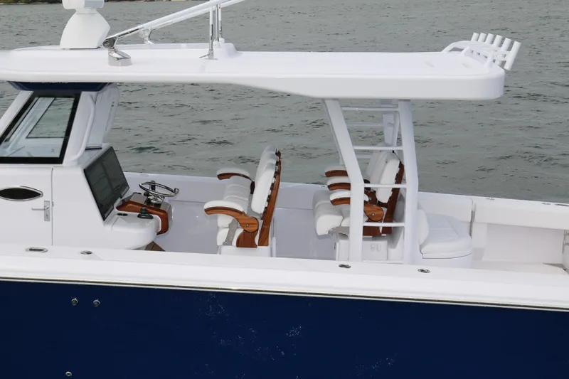  Yacht Photos Pics 2026 Bahama 41 GT boat with sleek design, white seating, and modern helm.