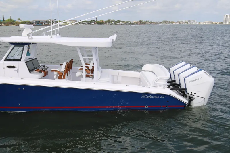  Yacht Photos Pics 2026 Bahama 41 GT boat with triple Mercury engines on the water.