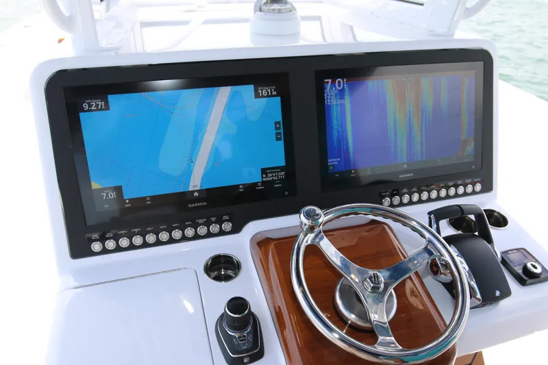  Yacht Photos Pics Control panel of 2026 Bahama 41 GT boat with dual Garmin displays.