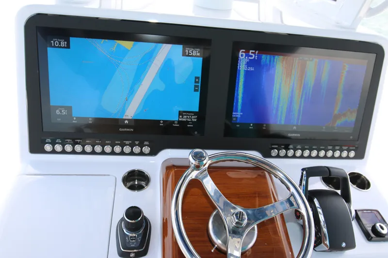  Yacht Photos Pics Dashboard of 2026 Bahama 41 GT with dual Garmin displays and steering wheel.