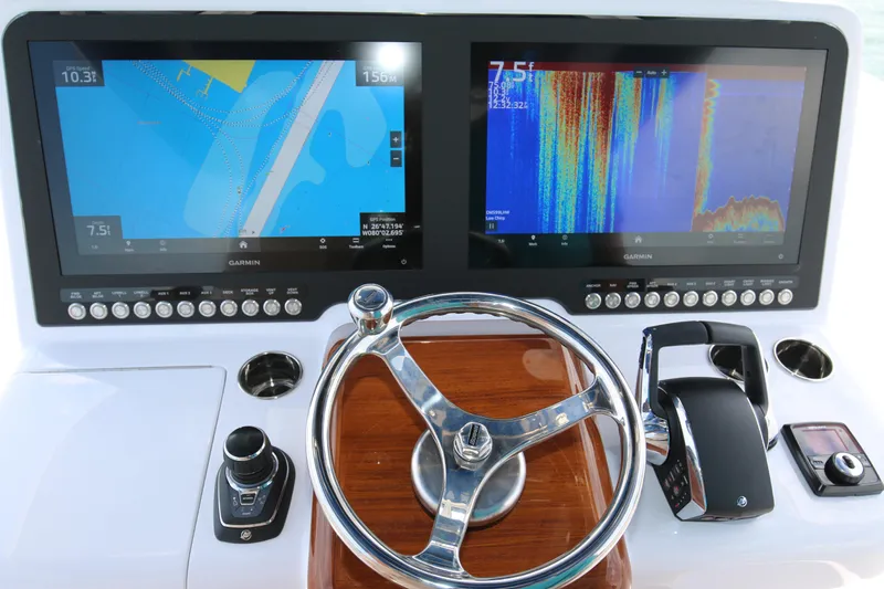  Yacht Photos Pics Steering console of 2026 Bahama 41 GT with dual Garmin displays and controls.